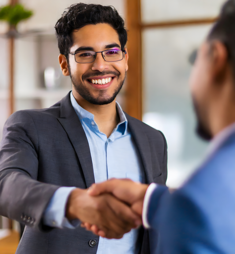confident-businessman-shaking-hands-with-his-client 1